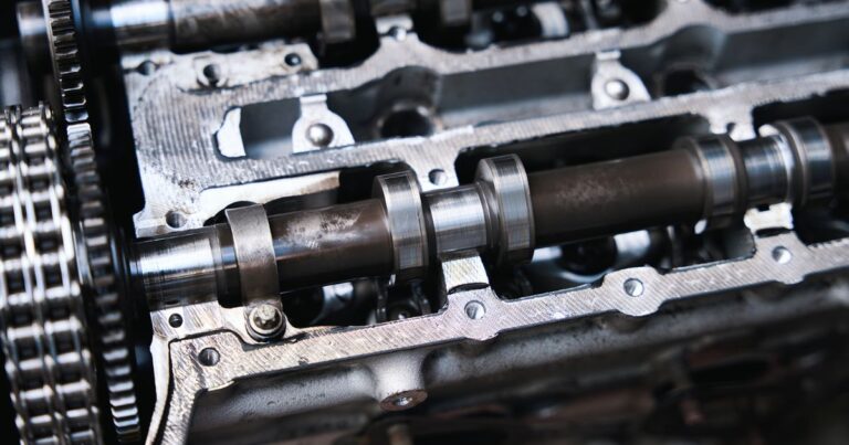 Automotive camshaft machining process with grinding, heat treatment, and inspection stages