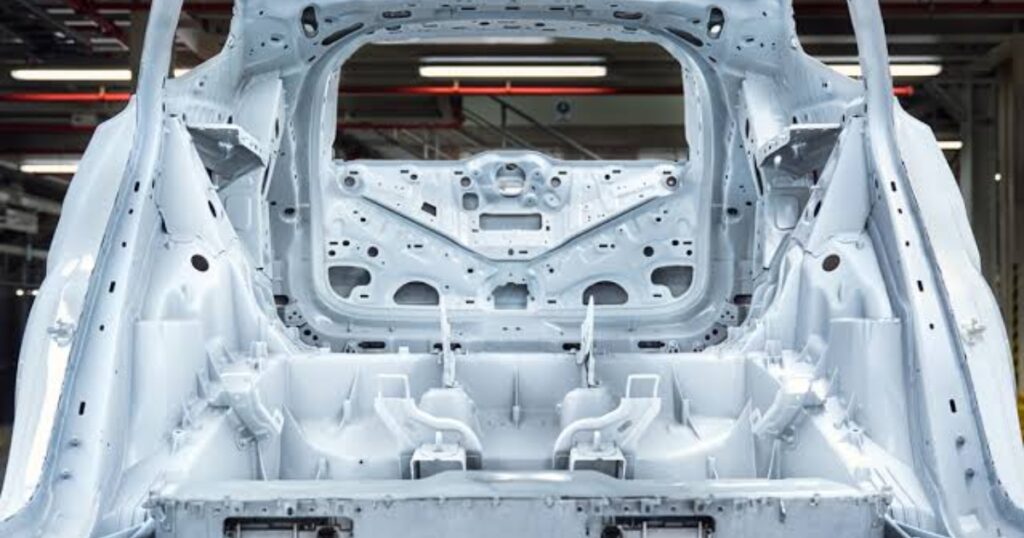 CNC machining of die-cast parts: a large gigacast aluminum EV body casting machined to tolerance