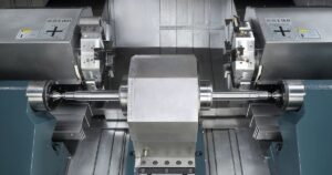 Machining track rollers on a center-drive CNC lathe for coaxiality and productivity gains