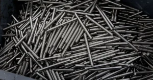Solutions 11 Stainless steel bar stock used as feedstock for the CNC Swiss-type lathe machining process