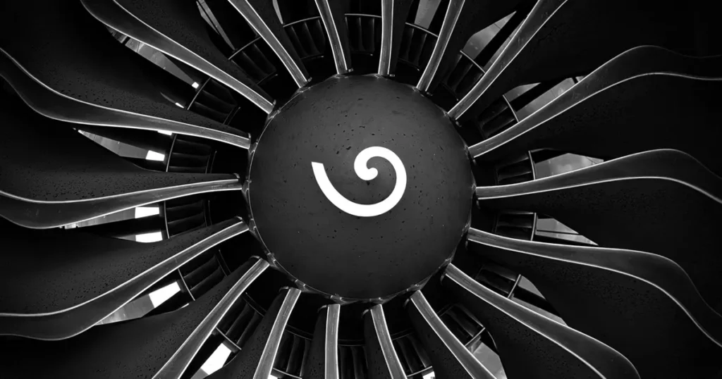Turbine Blade Preform Forging: Root-Metal Control 9 Turbine blade preform forging represented by a close-up of jet engine turbine blades