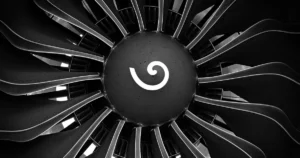 Turbine blade preform forging represented by a close-up of jet engine turbine blades