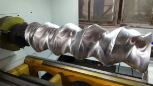 Helical rotor clamped and supported in a machine setup for CNC whirling machine selection