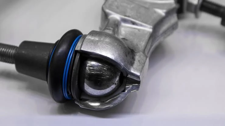 Cutaway steering ball joint showing the ball stud, housing and dust boot